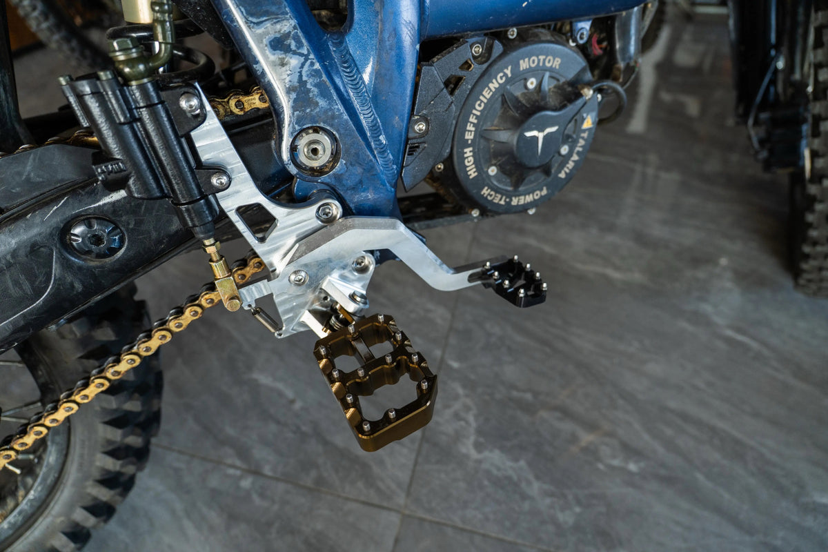 Talaria MX5 hydraulic foot brake kit installed on the bike